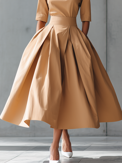 VESTIDO MIDI SATINADO CON FALDA DE VUELO Y CORTE ESTRUCTURADO